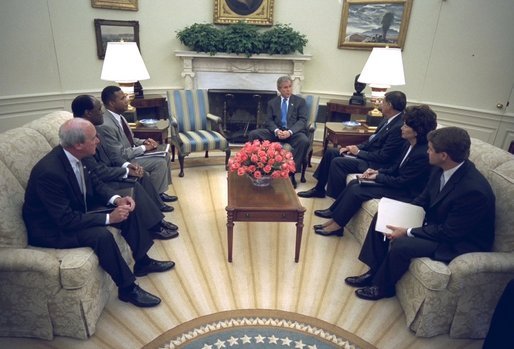 President George W. Bush discusses faith-based administrative reforms with Cabinet Members in the Oval Office Monday, Sept. 22, 2003. They are, from left, Deputy Secretary of Education Eugene Hickok, Deputy Secretary of Veterans Affairs Leo Mackay, Deputy Secretary of Health and Human Services Claude Allen, Secretary of Housing and Urban Development Mel Martinez, Secretary of Labor Elaine Chao, and Director of USA Freedom Corps John Bridgeland. White House photo by Eric Draper