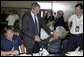 After delivering remarks about Hurricane Isabel, President George W. Bush personally thanks FEMA staff at the temporary operations center housed at the Virginia State Police Academy in Richmond, Va., Monday, Sept. 22, 2003. "There's a lot of neighborliness taking place in the state of Virginia and North Carolina and Maryland, where if somebody hurts and somebody's lonely, somebody needs help is finding refuge and solace because a fellow citizen has taken it upon him or herself to help somebody in need," said the President. White House photo by Paul Morse