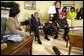 President George W. Bush meets with senior Iraqi officials in the Oval Office Monday, Sept. 22, 2003. They are Nasreen Barwari, Minister of Public Works, left, and Dr. Aiham Alsammarae, Minister of Electricity. White House photo by Eric Draper.