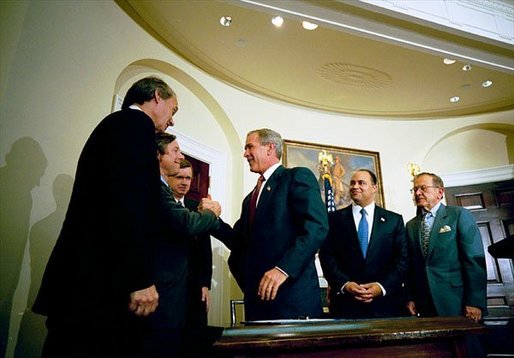 President George W. Bush signs the Do Not Call Registry in the Roosevelt Room Sept. 29, 2003. Pictured with the President are, from left, Rep. Edward Markey, D-Mass.; Rep. Fred Upton, R-Mich.; Federal Trade Commission Chairman Timothy Muris; Rep. Billy Tauzin, R-La. (behind President Bush); Federal Communications Commission Chairman Michael Powell; and Sen. Ted Stevens, R-Alaska. White House photo by Eric Draper.