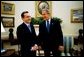 President George W. Bush hosts a visit by Colombian President Alvaro Uribe to the Oval Office Wednesday, Oct. 1, 2003. White House photo by Eric Draper.