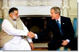 President George W. Bush meets with Prime Minister Mir Zafarullah Khan Jamali of Pakistan in the Oval Office Wednesday, Oct. 1, 2003.  White House photo by Eric Draper