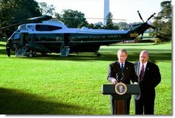 President George W. Bush and Former New York City Police Commissioner Bernard Kerik discuss the creation of police forces in Iraq during a joint address to the media on the South Lawn Friday, Oct. 3, 2003. "Four months ago -- four-and-a-half months ago, when I arrived in Iraq, there were no police -- very few, if any," said Mr. Kerik. "In the last four months, we brought back more than 40,000 police, 450 cars in Baghdad, stood up 35 police stations in Baghdad."  White House photo by Eric Draper