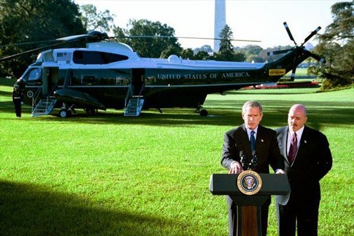 President George W. Bush and Former New York City Police Commissioner Bernard Kerik discuss the creation of police forces in Iraq during a joint address to the media on the South Lawn Friday, Oct. 3, 2003. "Four months ago -- four-and-a-half months ago, when I arrived in Iraq, there were no police -- very few, if any," said Mr. Kerik. "In the last four months, we brought back more than 40,000 police, 450 cars in Baghdad, stood up 35 police stations in Baghdad." White House photo by Eric Draper