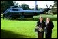 President George W. Bush and Former New York City Police Commissioner Bernard Kerik discuss the creation of police forces in Iraq during a joint address to the media on the South Lawn Friday, Oct. 3, 2003. "Four months ago -- four-and-a-half months ago, when I arrived in Iraq, there were no police -- very few, if any," said Mr. Kerik. "In the last four months, we brought back more than 40,000 police, 450 cars in Baghdad, stood up 35 police stations in Baghdad." White House photo by Eric Draper