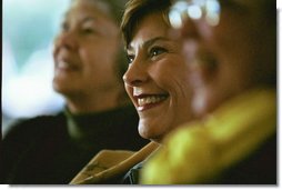 Laura Bush enjoys presentations by authors during the 2003 National Book Festival on the National Mall in Washington, D.C., Oct. 4, 2003.  White House photo by Susan Sterner