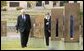 Vice President Dick Cheney walks with Don Ferrell (not pictured) through the Field of Empty Chairs to the chair of Susan Ferrell, Don Ferrell’s daughter, at the Oklahoma City National Memorial in Oklahoma City, Okla., Oct. 9, 2003. The field contains 168 chairs, one for each person who died in the bombing of the Federal Building. White House photo by David Bohrer.