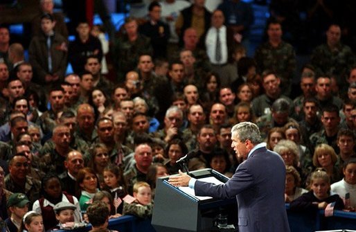 President George W. Bush delivers remarks to the New Hampshire Air National Guard, Army National Guard, Reservists and their families at Pease Air National Guard Base in Portsmouth, N.H., Thursday, Oct. 9, 2003. "Militia and volunteers and guardsmen have served from the Revolution to the Civil War, to World War II, to Desert Storm. Honor and service and courage are great New Hampshire traditions, and you're upholding those traditions," said the President in his remarks. White House photo by Tina Hager