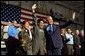 President George W. Bush is welcomed by a member of the New Hampshire Air National Guard at Pease Air National Guard Base in Portsmouth, N.H., Thursday, Oct. 9, 2003. White House photo by Tina Hager