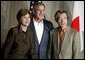 Photo.President George W. Bush and Laura Bush stand with Japanese Prime Minister Junichiro Koizumi before meeting for dinner in Tokyo during the first stop of the President's trip to Asia and Australia Thursday, Oct. 16, 2003. White House photo by Paul Morse