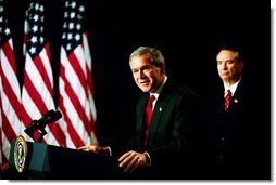 As Health and Human Services Secretary Tommy Thompson stands by, President George W. Bush discusses Medicare in the Dwight D. Eisenhower Executive Office Building Tuesday, Oct. 29, 2003. "The best way to provide our seniors with modern medicine, including prescription drug coverage and better preventative care, is to give them better choices under Medicare," said the President talking about pending Medicare legislation  White House photo by Tina Hager