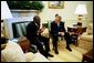 President George W. Bush meets with President Joseph Kabila of the Democratic Republic of the Congo in the Oval Office Wednesday, Nov. 5, 2003. The two leaders discussed a range of issues, including regional stability, trade and development, HIV/AIDS and the war on terrorism. White House photo by Paul Morse