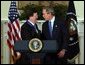 President George W. Bush congratulates NATO Secretary General Lord George Robertson after awarding him the Presidential Medal of Freedom during a ceremony in the Roosevelt Room Wednesday, Nov. 12, 2003. White House photo by Tina Hager.