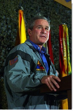 President George W. Bush delivers remarks to troops on Thanksgiving Day in Baghdad, Iraq. Thursday, November 27, 2003.  White House photo by Tina Hager