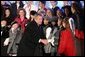 President George W. Bush greets the Voena Children's Choir at the Pageant of Peace after lighting the National Christmas Tree at the Ellipse in Washington DC on Thursday December 4, 2003. White House photo by Paul Morse.