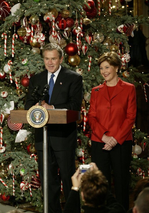 President George W. Bush and Laura Bush host a Christmas reception for children of deployed military personnel at the White House Monday, Dec. 8, 2003. A variety of activities were held for the children, including a performance of selected scenes from The Nutcracker and a visit by Santa Claus. White House photo by Eric Draper