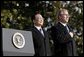 President George W. Bush and Premier Wen Jiabao of China stand for the playing their national anthems during an Arrival Ceremony on the South Lawn Tuesday, Dec. 9, 2003. White House photo by Paul Morse