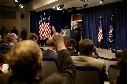 Discussing President George W. Bush takes questions during a press conference in the Dwight D. Eisenhower Executive Office Building Monday, Dec. 15, 2003. White House photo by Paul Morse