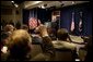 Discussing President George W. Bush takes questions during a press conference in the Dwight D. Eisenhower Executive Office Building Monday, Dec. 15, 2003. White House photo by Paul Morse