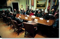 President George W. Bush meets with Iraqi physicians and Dr. Khudair Abbas, the Iraqi Interim Minister of Health, in the Roosevelt Room Monday, Dec. 15, 2003. Dr. Abbas is sitting at the President's right. The President and the visiting physicians discussed the improvements being made to Iraq's health system, including the establishing of a $950 million health care budget for 2004. Saddam Hussein's regime provided $16 million for the Ministry of Health in 2002, a 90 percent reduction from a decade earlier.  White House photo by Eric Draper