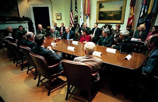 President George W. Bush meets with Iraqi physicians and Dr. Khudair Abbas, the Iraqi Interim Minister of Health, in the Roosevelt Room Monday, Dec. 15, 2003. Dr. Abbas is sitting at the President's right. The President and the visiting physicians discussed the improvements being made to Iraq's health system, including the establishing of a $950 million health care budget for 2004. Saddam Hussein's regime provided $16 million for the Ministry of Health in 2002, a 90 percent reduction from a decade earlier. White House photo by Eric Draper.