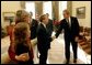 President George W. Bush congratulates Senator Mike DeWine, R-Ohio, on S. 650, the Pediatric Equity Research Act of 2003, in the Oval Office Tuesday, Dec. 16, 2003. Senator DeWine's daughter and wife, Fran, are pictured at the left. Also pictured are Senator Bill Frist, R-Tenn., left, and Health and Human Services Secretary Tommy Thompson. The act gives the Food and Drug Administration the authority to require drug companies to conduct safety tests on pharmaceuticals that are to be administered to children. The President signed the bill into law Dec. 3, 2003. White House photo by Tina Hager.