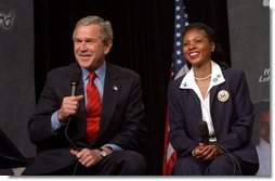 President George W. Bush discusses the No Child Left Behind Act at Pierre Laclede Elementary School with Principal Yolanda Moss and other faculty members in St. Louis, Mo., Monday, Jan. 5, 2004. "This school is a school that has performed -- you have to say, brilliantly," said President Bush of Lacledes' raising the grade level reading of third grade students from 7 percent in 1999 to 80 percent today. "That speaks to strong principals, it speaks to really good teachers. It says this school has got teachers that believe in the capability of every child. It says the school has raised standards and is not afraid to measure."  White House photo by Tina Hager