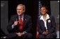 President George W. Bush discusses the No Child Left Behind Act at Pierre Laclede Elementary School with Principal Yolanda Moss and other faculty members in St. Louis, Mo., Monday, Jan. 5, 2004. "This school is a school that has performed -- you have to say, brilliantly," said President Bush of Lacledes' raising the grade level reading of third grade students from 7 percent in 1999 to 80 percent today. "That speaks to strong principals, it speaks to really good teachers. It says this school has got teachers that believe in the capability of every child. It says the school has raised standards and is not afraid to measure." White House photo by Tina Hager