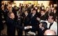 President George W. Bush greets enthusiastic audience members after discussing his immigration policy in the East Room Wednesday, Jan. 7, 2004. White House photo by Paul Morse.