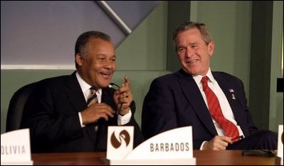 President George W. Bush talks with the Prime Minister Owen Arthur of Barbados during the inaugural ceremony of the Special Summit of the Americas in Monterrey, Mexico, Jan. 12, 2004. White House photo by Paul Morse