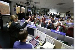 Vice President Dick Cheney listens to a briefing on NASA's Spirit and Opportunity Expeditions to Mars in the Jet Propulsion Laboratory's mission control room in Pasadena, Calif., Jan 14, 2004. JPL developed and now remotely controls the rover Spirit since it landed on the planet Jan. 3, 2004. Sitting next to Vice President Cheney are, from left, Dr. Frederick D. Gregory, NASA Deputy Administrator, Dr. David Baltimore, President of the California Institute of Technology and Dr. Charles Elachi, the Director of the Jet Propulsion Laboratory.  White House photo by David Bohrer