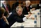 President George W. Bush holds a roundtable conversation about the positive effects that faith-based initiatives have had on local people at Union Bethel African Methodist Episcopal Church in New Orleans, La., Thursday, Jan. 15, 2004. "We just had a lot of people from the community, people who have been helped, people who are helping, neighborhood healers here to share their stories," said the President about the discussion in his remarks. White House photo by Eric Draper