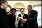 President George W. Bush reviews his State of the Union speech in the Oval Office Tuesday morning, January 20, 2004, with Communications Director Dan Bartlett, at left, Staff Secretary Brett Kavanaugh, National Security Adviser Condoleezza Rice and Mike Gerson, Director of Presidential Speech Writing. White House photo by Eric Draper