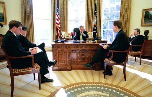 President George W. Bush meets with speechwriters to prepare for his State of the Union speech in the Oval Office Jan. 16, 2004 White House photo by Eric Draper