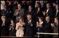 Mrs. Bush applauds her special guest, Dr. Adnan Pachachi, President of the Iraqi Governing Council, during President Bush's State of the Union Address at the U.S. Capitol Tuesday, Jan. 20, 2004. "Sir, America stands with you and the Iraqi people as you build a free and peaceful nation," said the President in his acknowledgement of Dr. Pachachi. White House photo by Paul Morse