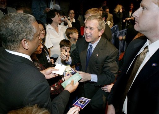 President George W. Bush greets audience members following a discussion on job training and the economy at Mesa Community College in Mesa, Arizona, Wednesday, Jan. 21, 2004. White House photo by Eric Draper