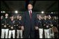 President George W. Bush stands on stage during his introduction before speaking on the war on terror at the Roswell Convention Center in Roswell, New Mexico, Thursday, Jan. 22, 2004. White House photo by Eric Draper