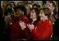 Laura Bush listsens with Assistant Secretary for Health (acting) Dr. Cristina Beato, center, and heart attack survivor Joyce Cullen, left, during White House ceremonies to launch American Heart Month. The event, part of the national Heart Truth campaign, was held to highlight the issue of heart disease as the number-one killer of women in the United States. Monday, Feb. 2, 2004. White House photo by Susan Sterner