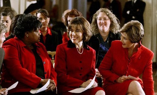 Laura Bush and Assistant Secretary for Health (acting) Dr. Cristina Beato, center, listen to heart attack survivor Joyce Cullen. Ms. Cullen spoke about her experiences as a survivor during a White House ceremony held as part of the national Heart Truth campaign to raise awareness of heart disease as the number-one killer of women in the United States. Monday, Feb. 2, 2004. White House photo by Susan Sterner