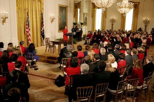 Laura Bush talks about the importance of educating women and doctors on the risks of heart disease and the basic preventive measures of exercise, a healthy diet, and regular medical screening during a Heart Truth campaign event at the White House Monday, Feb. 2, 2004. White House photo by Paul Morse