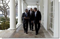 President George W. Bush and United Nations Secretary General Kofi Annan walk with Secretary of State Colin Powell along the colonnade in the Rose Garden at the White House Tuesday, Feb. 3, 2004.  White House photo by Paul Morse