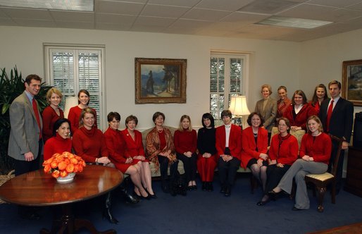 Supporting The Heart Truth campaign, Laura Bush and her staff celebrate the first annual National Wear Red Day in support of women's heart disease awareness, Friday, Feb. 6, 2004. The color red is worn to symbolize the commitment to fight heart disease and to educate every American about the power of prevention. White House photo by Tina Hager