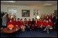 Supporting The Heart Truth campaign, Laura Bush and her staff celebrate the first annual National Wear Red Day in support of women's heart disease awareness, Friday, Feb. 6, 2004. The color red is worn to symbolize the commitment to fight heart disease and to educate every American about the power of prevention. White House photo by Tina Hager