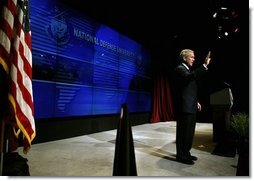 President George W. Bush waves after delivering remarks on Weapons of Mass Destruction Proliferation at the National Defense University at Ft. McNair, Wednesday, Feb. 11, 2004.  White House photo by Eric Draper