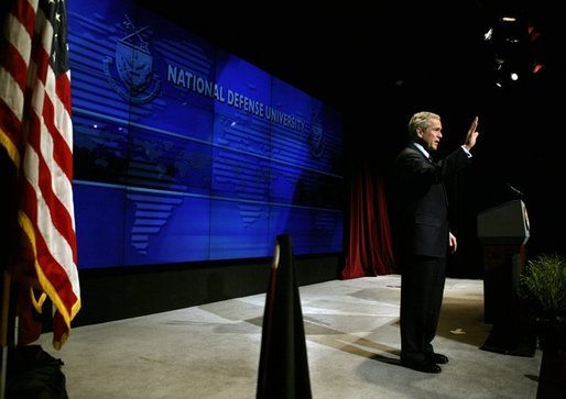 President George W. Bush waves after delivering remarks on Weapons of Mass Destruction Proliferation at the National Defense University at Ft. McNair, Wednesday, Feb. 11, 2004. White House photo by Eric Draper.