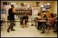 Laura Bush attends a classroom discussion with Mr. David Chapman’s history students at Bentonville High School in Bentonville, Ark., Tuesday, Feb. 17, 2004. "Teaching is one of the most difficult jobs, but it's also the most rewarding. What you do in the classroom determines your children's future and the future of our country," said Mrs. Bush in her remarks about education. White House photo by Tina Hager