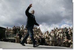 President George W. Bush receives cheers before giving remarks to military personnel at Fort Polk, La., Tuesday, Feb. 17, 2004. "In the war, America depends on our military to meet the dangers abroad and to keep our country safe," said the President. "The American people appreciate this sacrifice. And our government owes you more than gratitude."  White House photo by Paul Morse