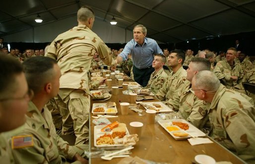 President George W. Bush greets national guardsmen as he joins them for lunch at Fort Polk, La., Tuesday, Feb. 17, 2004. White House photo by Paul Morse.