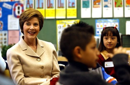 Laura Bush participates in a reading lab with third and fourth graders at Limerick Elementary school in Los Angeles, California, Wednesday, February 18, 2004. "We know that if children don't learn to read by the end of the 3rd grade or 4th grade, their chances for learning to read decrease every year, and by the time they get to high school they're often the ones who drop out because of frustration that they -- over not being able to read," said Mrs. Bush during her visit to Limerick Elementary. White House photo by Tina Hager