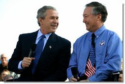 President George W. Bush talks with Rain for Rent President John Lake during a Conversation on the Economy at Rain for Rent in Bakersfield, Calif., Thursday, March 3, 2004.  White House photo by Eric Draper